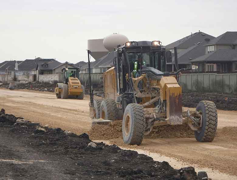 Tractor on the land with mud area