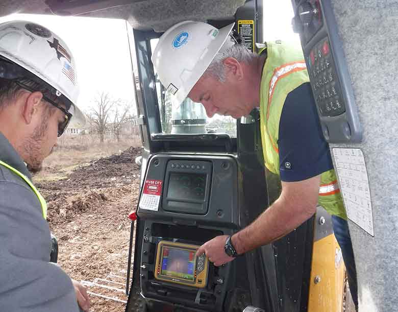 Two Engineers working on tractor machine